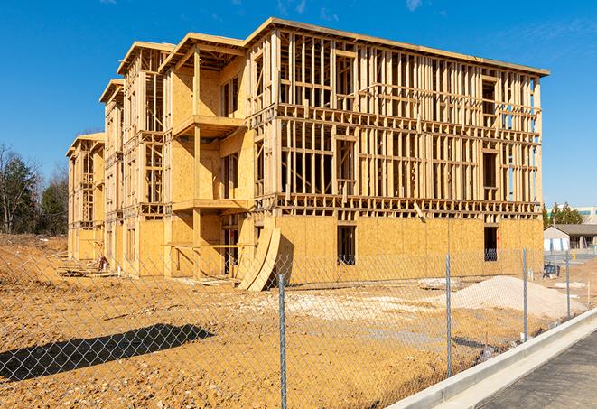 a snapshot of temporary chain link fences protecting a large construction project from unauthorized access in Harwinton